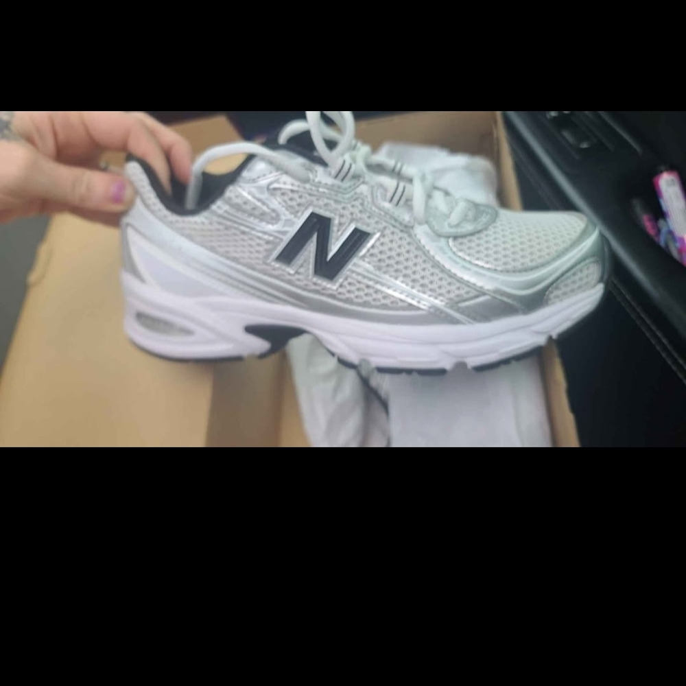 New Balance Silver and Black Sneakers